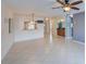 Spacious living area with tile floors, ceiling fan, and a pass-through to the kitchen offering a modern design at 766 Avenida Estancia # 196, Venice, FL 34292