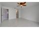 The spacious main bedroom has tile floors and an attached bathroom at 766 Avenida Estancia # 196, Venice, FL 34292