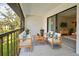 Relaxing screened patio featuring comfortable seating and a view of the lush outdoor landscape at 766 Avenida Estancia # 196, Venice, FL 34292