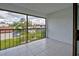 Inviting screened patio with a view of the lush community landscape at 766 Avenida Estancia # 196, Venice, FL 34292