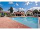 Beautiful community pool, with plenty of lounge chairs and umbrellas at 766 Avenida Estancia # 196, Venice, FL 34292
