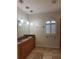 Elegant bathroom with double sinks, granite countertops, and tile floors at 1219 Nantucket Rd, Venice, FL 34293