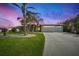 Attractive single-story home with a three-car garage and manicured lawn at 1219 Nantucket Rd, Venice, FL 34293