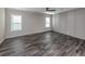 Bright bedroom with gray walls and dark gray vinyl flooring at 127 Nautical Dr, North Port, FL 34287