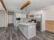 Modern kitchen with stainless steel appliances and a large island at 127 Nautical Dr, North Port, FL 34287