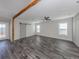 Open living room with gray walls and wood beam feature at 127 Nautical Dr, North Port, FL 34287