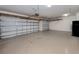 Two-car garage with overhead storage at 13240 Amerigo Ln, Venice, FL 34293