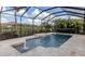 Inviting screened pool with fountain and travertine deck at 13240 Amerigo Ln, Venice, FL 34293