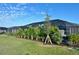 Backyard featuring tropical landscaping surrounding a screened-in pool at 19045 Moscato Ct, Venice, FL 34293