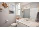 Bathroom with large vanity, sink, shower, decorative mirror and nautical decor at 19045 Moscato Ct, Venice, FL 34293