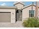 Close-up view of a home's front entrance with a paved walkway and well-kept landscaping at 19045 Moscato Ct, Venice, FL 34293