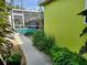 Landscaped walkway leading to a refreshing pool, perfect for a relaxing afternoon at 231 Victoria Rd, Venice, FL 34293