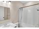 Updated bathroom with tub, toilet, and vanity at 25544 Royal Tern Ln, Englewood, FL 34223