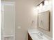 Well-lit bathroom with vanity and mirror at 25544 Royal Tern Ln, Englewood, FL 34223