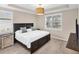 Spacious bedroom with a king-size bed and neutral decor at 25544 Royal Tern Ln, Englewood, FL 34223