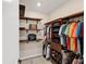 Large walk-in closet with custom shelving and drawers at 25544 Royal Tern Ln, Englewood, FL 34223