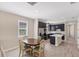 Modern kitchen with dark cabinetry and breakfast nook at 25544 Royal Tern Ln, Englewood, FL 34223