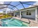 Inviting pool and patio area with a covered lanai at 25544 Royal Tern Ln, Englewood, FL 34223