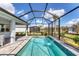 Enjoy this refreshing screened pool and lanai at 25544 Royal Tern Ln, Englewood, FL 34223