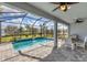 Relaxing screened pool and lanai with seating area at 25544 Royal Tern Ln, Englewood, FL 34223