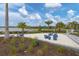 Relaxing sand play area with seating and landscaping at 25544 Royal Tern Ln, Englewood, FL 34223