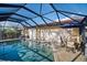 Refreshing screened pool and patio perfect for outdoor relaxation at 1701 Boca Raton Ct, Punta Gorda, FL 33950