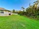 Large backyard with lush landscaping at 18194 Driggers Ave, Port Charlotte, FL 33948