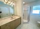 Bathroom with single vanity and corner shower at 18194 Driggers Ave, Port Charlotte, FL 33948