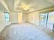 Main bedroom with carpet flooring and sliding glass doors at 18194 Driggers Ave, Port Charlotte, FL 33948