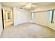 Spacious bedroom with ample closet space and carpet flooring at 18194 Driggers Ave, Port Charlotte, FL 33948