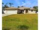 House exterior showcasing a well-maintained lawn at 18194 Driggers Ave, Port Charlotte, FL 33948