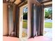 Garage with accordion-style storage system at 18194 Driggers Ave, Port Charlotte, FL 33948