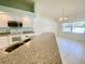 Kitchen with breakfast bar and view to dining area at 18194 Driggers Ave, Port Charlotte, FL 33948