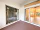 View of patio with sliding glass doors leading to interior at 18194 Driggers Ave, Port Charlotte, FL 33948