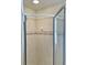 Clean shower with tiled walls and glass enclosure at 18194 Driggers Ave, Port Charlotte, FL 33948