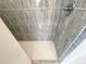 Stand-up shower with grey tile walls at 18194 Driggers Ave, Port Charlotte, FL 33948