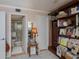 Bedroom with bathroom access and built-in shelving at 250 Santa Maria St # 118, Venice, FL 34285