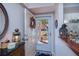Bright condo entryway with decorative wreath at 250 Santa Maria St # 118, Venice, FL 34285