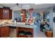 Kitchen features granite countertops, wood cabinets, and stainless steel appliances at 250 Santa Maria St # 118, Venice, FL 34285