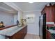 Kitchen with granite countertops, wood cabinets, and a refrigerator at 250 Santa Maria St # 118, Venice, FL 34285