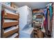 Stackable washer and dryer in well-organized closet at 250 Santa Maria St # 118, Venice, FL 34285