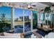 Sunroom with water views and access to a patio at 250 Santa Maria St # 118, Venice, FL 34285
