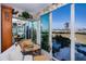 Sunroom with water views and access to a patio at 250 Santa Maria St # 118, Venice, FL 34285