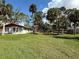 House with spacious yard and tropical landscaping at 506 Kenwood Ave, Nokomis, FL 34275