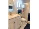 Clean bathroom with shower and updated vanity at 5581 Linksman Pl, North Port, FL 34287