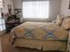 Bedroom with a king-size bed and home office space at 5581 Linksman Pl, North Port, FL 34287