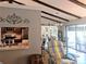 Kitchen and dining area with vaulted ceiling and exposed beams at 5581 Linksman Pl, North Port, FL 34287