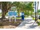 Centennial Park entrance with lush landscaping and walkways at 5581 Linksman Pl, North Port, FL 34287
