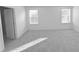 Spacious bedroom with carpet and two windows at 15467 Maynard Ave, Port Charlotte, FL 33953