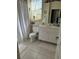 Clean bathroom with a single sink vanity and shower/tub combo at 25 Windsor Dr, Englewood, FL 34223